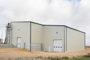 industrial building constructed with metal siding and trim and poured concrete floors