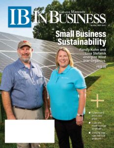 cover of In Business magazine showing a man and a woman in front of solar panels